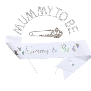 Detailed set featuring silver rhinestone crown, white Mommy to be sash and crown brooches