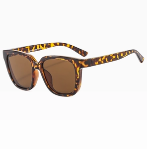 Detail of retro tortoiseshell square sunglasses with brown lenses at 45-degree angle