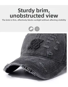 Detail of distressed brim and 3D embroidery on washed grey vintage baseball cap