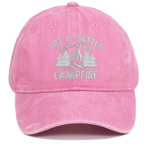 Detail of embroidered forest campfire logo and text on washed pink cotton baseball cap