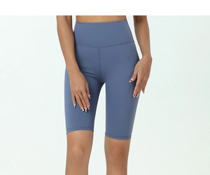 Detail of high-waisted yoga shorts in Morandi blue with elastic compression fabric