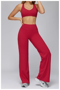 Detail of dark red yoga set featuring V-neck sports bra and high-waisted wide-leg pants
