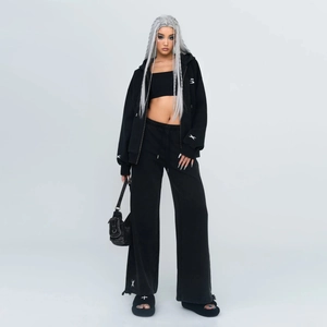 Women's black streetwear tracksuit set with wide-leg sweatpants and zip hoodie