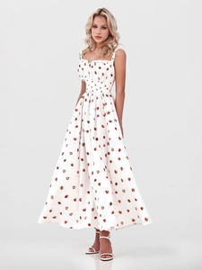 White floral spaghetti strap dress with red strawberry print and high waist slit hem