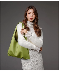 Avocado green leather tote bag shown with a model for professional office and casual use