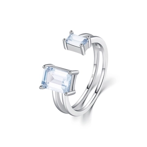 Double-layered 925 silver open ring with rectangle light blue crystals on white background