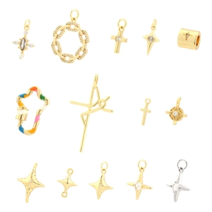 Variety of mini cross and star pendants in gold and silver plating with enamel details
