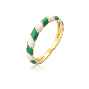 Close-up of bohemian gold plated open ring with green and white enamel details