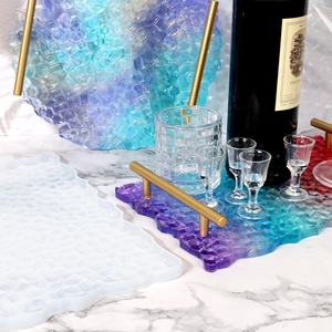 Detail of DIY resin tray silicone mold featuring honeycomb texture and golden handles