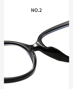 Macro shot of stylish black anti-blue light glasses bridge with glossy finish detail