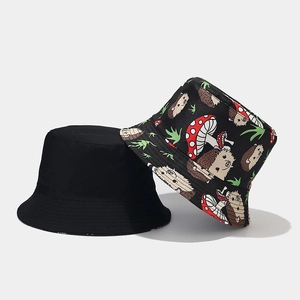 Reversible cartoon animal bucket hat featuring cute hedgehog prints and a classic black design