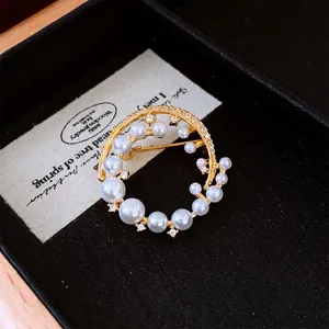 French vintage style 24k gold-plated circular pearl brooch with sparkling zircon accents