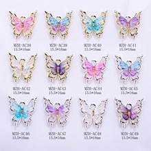 Detailed grid of aurora butterfly nail charms in 12 colors with 15.5x16mm dimensions