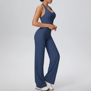 Side view of dark blue yoga set featuring halter neck top and high waist wide leg pants
