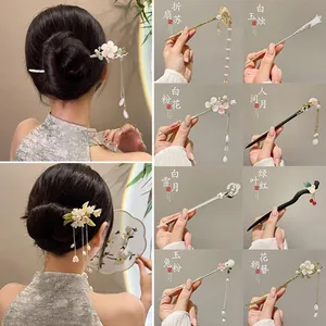 Detailed close-up of classical Chinese style hair pins with pearls and tassels in various colors