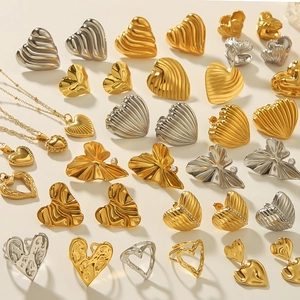 Lava heart jewelry set with gold and silver necklaces, earrings and open rings