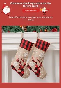 Detail of burlap Christmas stockings with elk embroidery hanging on a festive mantel