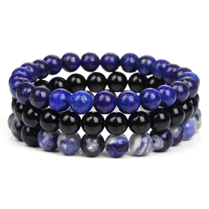 Detailed set of blue lapis, black onyx, and blue-white marbled natural stone bracelets