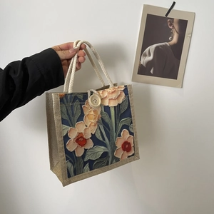 Detail of oil painting floral linen tote bag with rope handle and wooden button