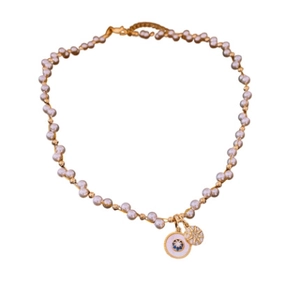 Gold plated necklace with round pearl zircon pendant and star sun charm on white background
