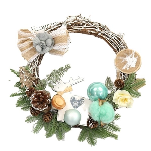 Christmas wreath with wood deer and pine cones on a rustic brown branch base