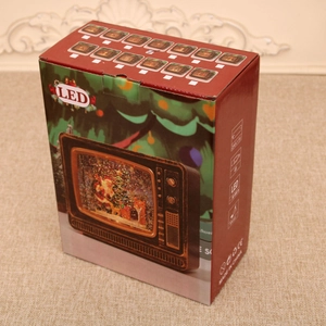 Detailed retail packaging for Christmas TV lantern showing LED and music specifications