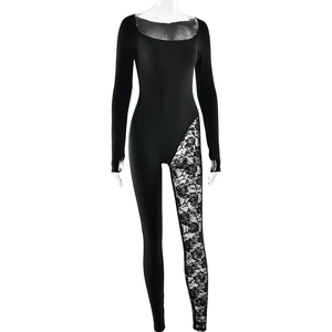 Detail of black long sleeve bodysuit featuring lace leg splice and floral patterns