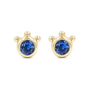 Detailed macro of S925 silver crown-shaped earrings with blue cat-eye stones