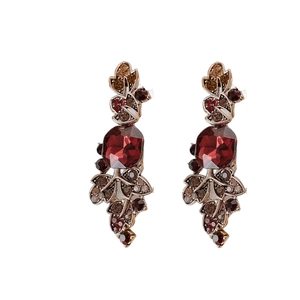 Vintage style drop earrings with red faceted gemstones and amber leaf-shaped crystals