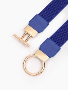 Detail of navy blue elastic belt featuring a minimalist gold ring and T-bar metal buckle