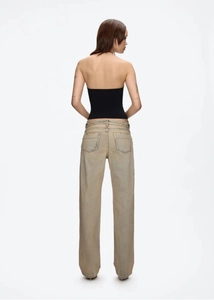 Rear view of tight black halter top and retro washed high waist straight leg jeans