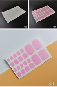 Detail view of J036 transparent and J037 pink glitter adhesive toe nail polish wraps