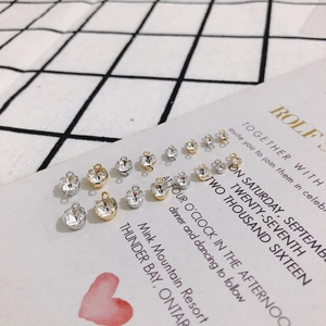 Macro shot of gold and silver plated rhinestone charms for DIY earring jewelry making