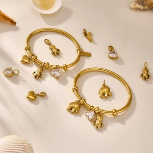 DIY charm bracelet in 18k gold plated stainless steel with bear and elephant pendants