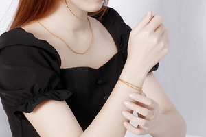 Detailed view of elegant gold stainless steel curb bead chain necklace and bracelet set