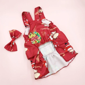 Detail of red floral pet Christmas dress with Santa motifs and matching bow accessory