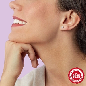 S925 Sterling Silver turquoise petal earrings worn by a model on a purple background