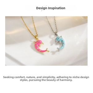 Detail view of magnetic dolphin pendants with enamel finish and small crystals