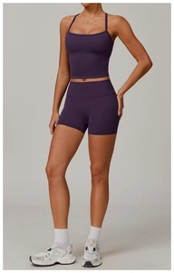 Detail view of deep purple brushed yoga set featuring square neck crop top and biker shorts