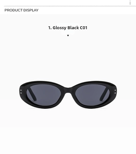 Detailed front view of glossy black oval sunglasses with silver metal dot accents