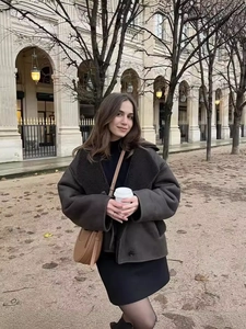 Women's dark brown faux shearling jacket with lapel collar and casual autumn styling