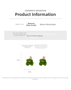 Detail view of large green clover acrylic earrings with gold texture and size dimensions
