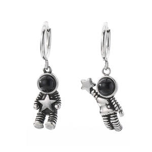 Stainless steel astronaut couple hoop earrings with star detail on white background