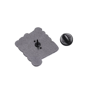 Creative enamel letter brooch featuring black textured metal back and rubber clutch pin