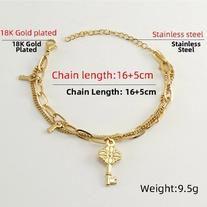 Detail of 18K gold plated stainless steel double layer bracelet with key charms
