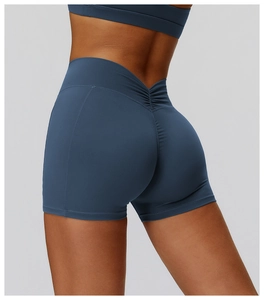 Rear view of high-waisted navy yoga shorts with V-shaped waistband and scrunch butt detail