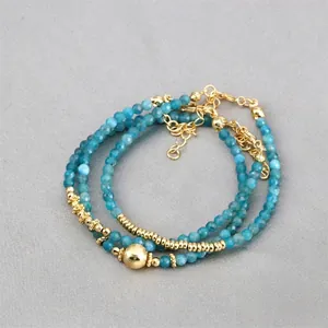 Minimalist adjustable bracelet with blue faceted gemstone beads and gold-plated accents