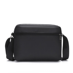 Black nylon crossbody bag with adjustable wide strap and back view on white background
