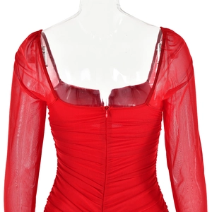 Detailed back view of red mesh dress with pleat design and hidden zipper closure