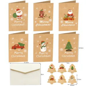 Flat lay of 6 kraft Christmas cards with hand-drawn designs, envelopes and stickers